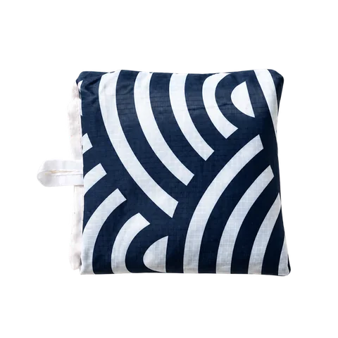The same navy tote folded for storage